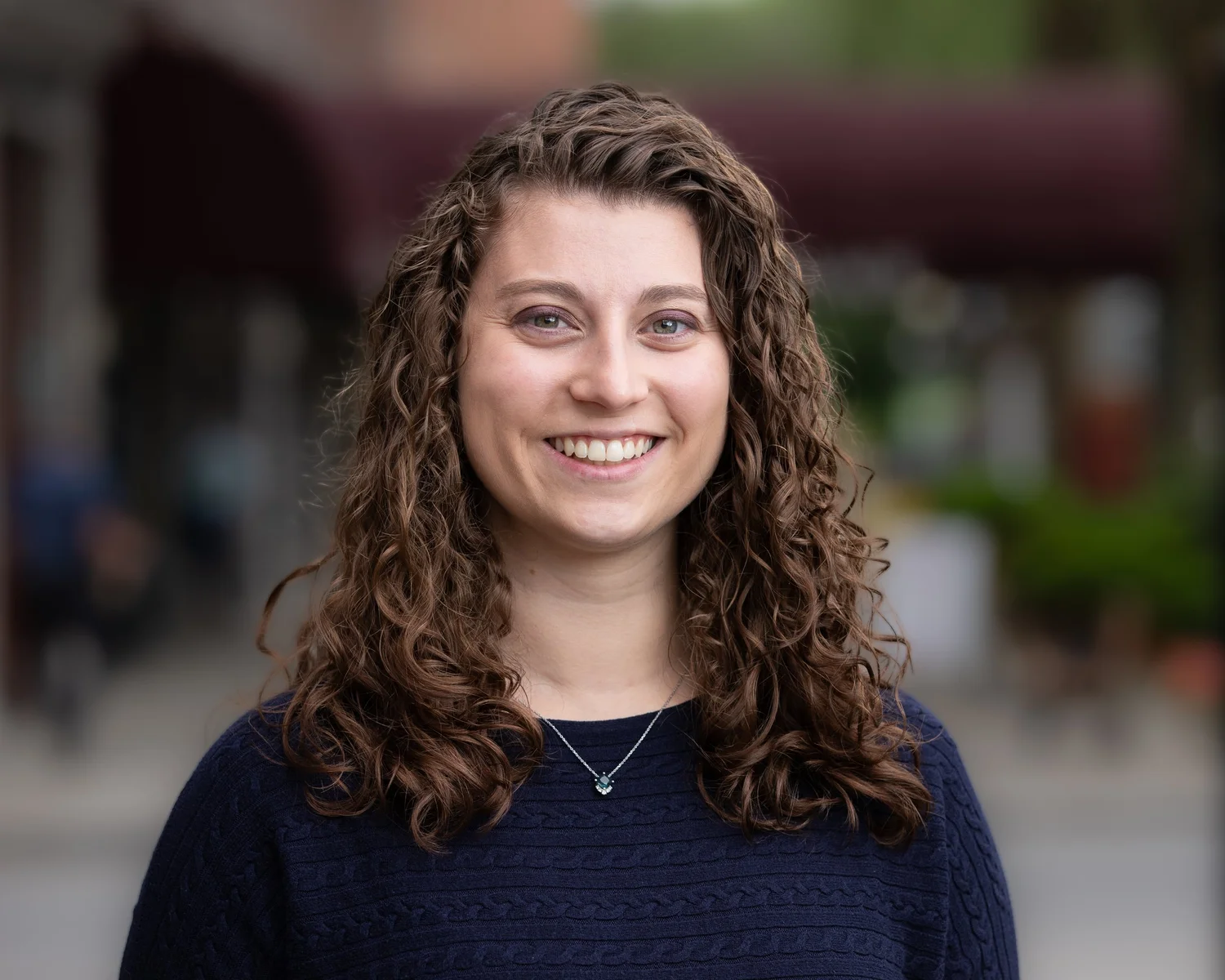 A smiling client photographed outdoors by P8 Headshots