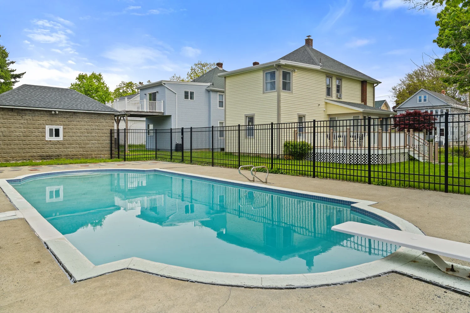 Backyard and pool photographed for a listing