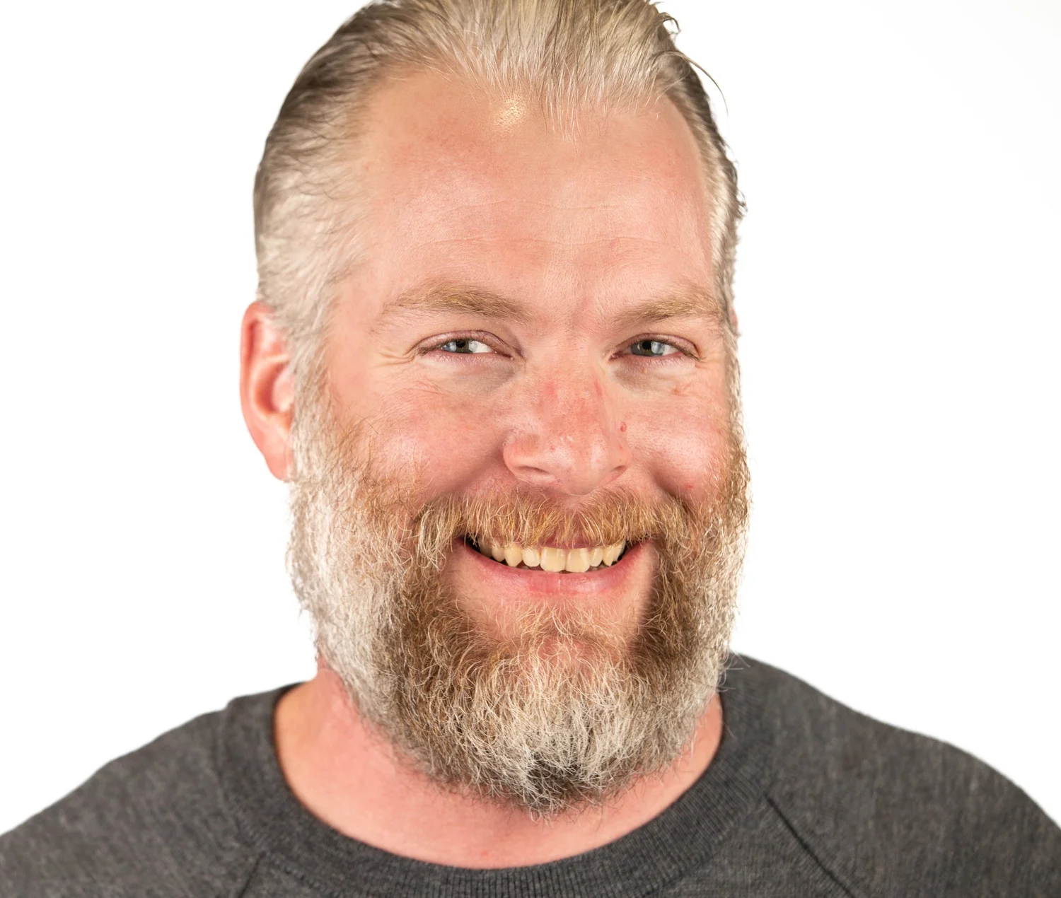 Confident headshot of a male team member